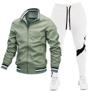 Green jacket and white pants with black accents on a white background