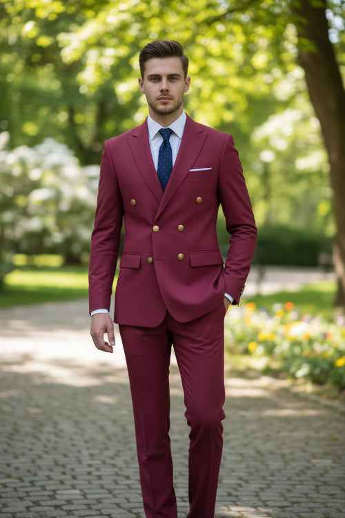Magenta suit with gold buttons on a light gray background