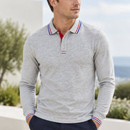 A light gray long-sleeve polo shirt with a red and blue striped collar and matching striped placket, shown on a white background 
