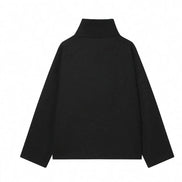 Back view of a black short coat with a high collar and dropped shoulders