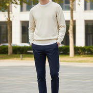 Folded dark blue pants with a brand logo on a gray background