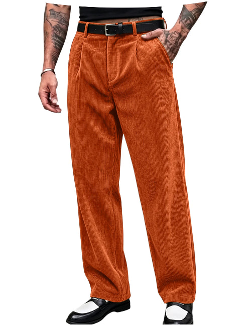 A person wearing high-waisted orange corduroy pants with a black belt, paired with black-and-white shoes, shown from the waist down 
