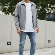 White sneakers with black and red accents on a gray background