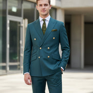 Teal suit with gold buttons on a mannequin and separate pants on a white background