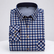 Folded blue and white checkered shirt with close-up of fabric texture on a white background