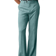 Teal pants worn by a person on a white background