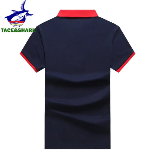 Navy blue polo shirt with red accents on a white background, featuring the Tace & Shark brand logo.