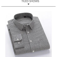 A folded long-sleeve button-up dress shirt with a small-scale black and white micro-check pattern, displayed on a clean white background 