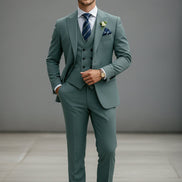 Green suit with tie and pocket square on a white background