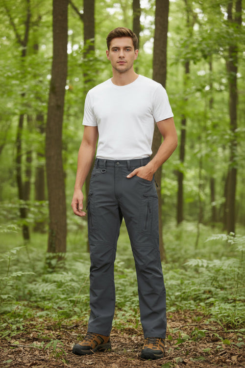 Gray hiking pants with multiple pockets and a brand logo on a white background