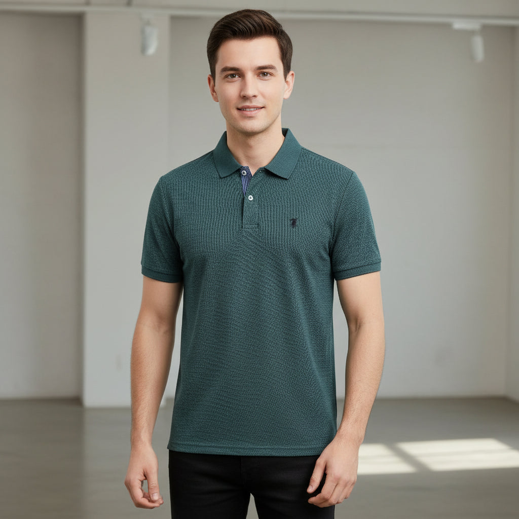 Collection of polo shirts in various colors hanging on a rack.