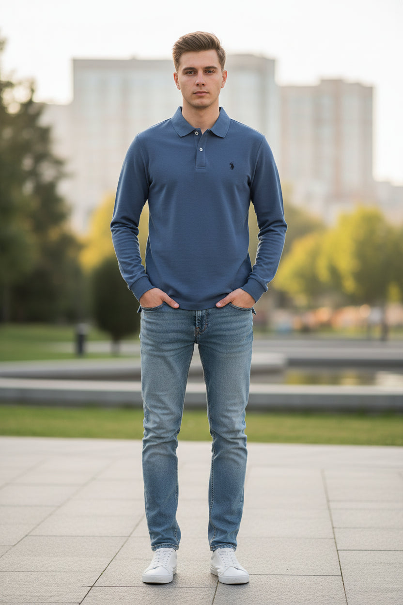 Blue long-sleeve polo shirt on a rack with other colored shirts in the background