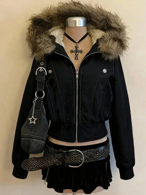 Black jacket with fur hood on a mannequin against a beige background