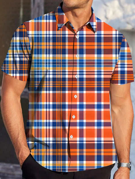 Person wearing a short-sleeve plaid shirt with orange, blue, and white pattern.