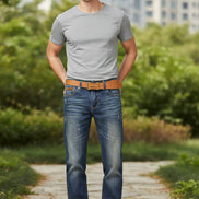 Blue jeans with a brown belt on a white background