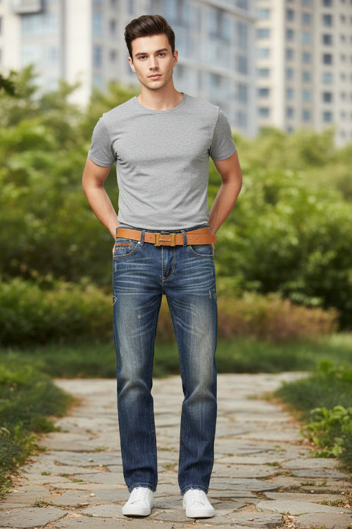 Blue jeans with a brown belt on a white background