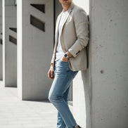 Pair of blue slip-on shoes with black accents on a white background