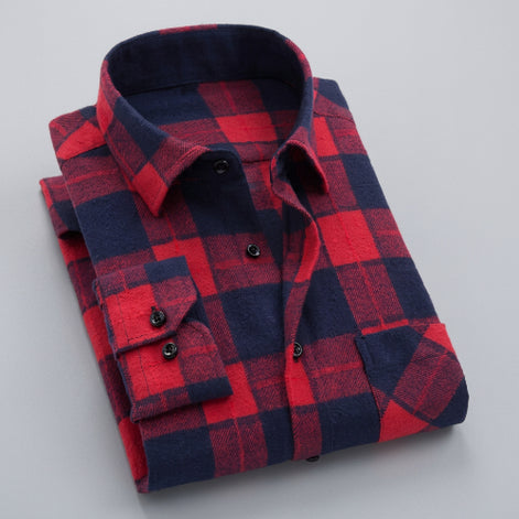 Folded red and navy checkered shirt on a white background