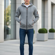 Gray hoodie with orange accents on a white background