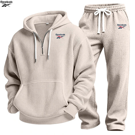 Beige waffle-textured hoodie and jogger pants set on a white background