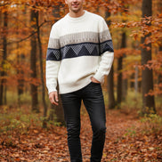 White sweater with black and gray geometric pattern on a white background