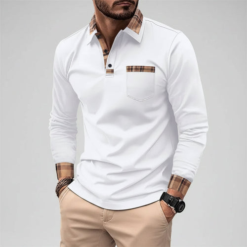 Man wearing a white long-sleeve shirt with plaid accents on a city street.