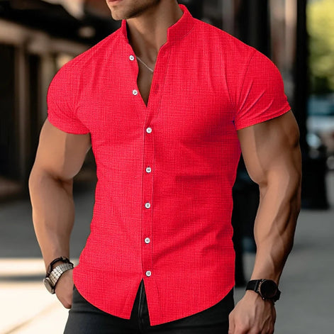 Man wearing a red short-sleeve shirt with a blurred background