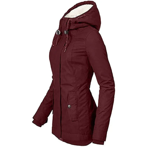 Side view of a burgundy hooded jacket with white fleece-look hood lining, drawstrings and a buttoned front pocket against a white background