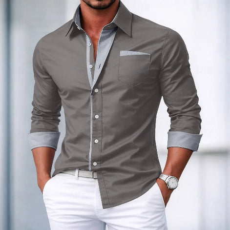 Man wearing a gray dress shirt with a white background