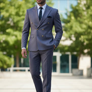 Gray suit with gold buttons worn by a person against a blurred background