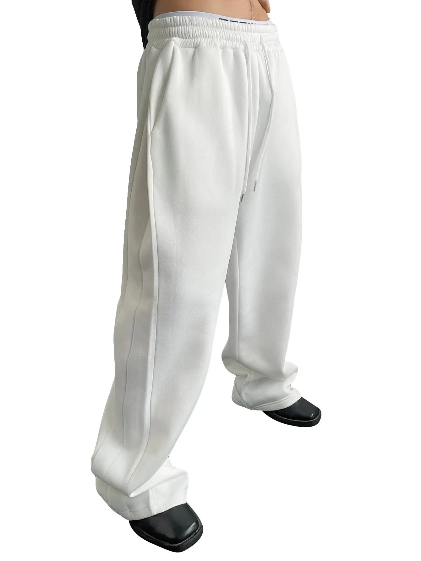 White wide-leg pants worn by a person on a white background