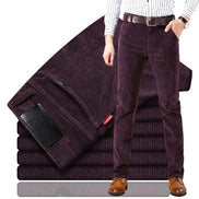 Purple corduroy pants with a stack of folded pants and a person wearing them on a white background.