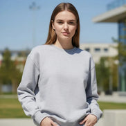 A light gray crewneck sweatshirt by KANNISAK, shown flat against a white background with a soft drop shadow.
