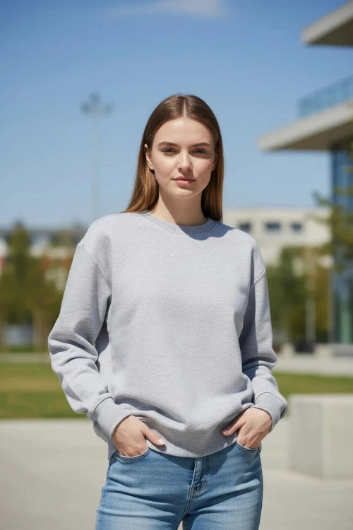 A light gray crewneck sweatshirt by KANNISAK, shown flat against a white background with a soft drop shadow.