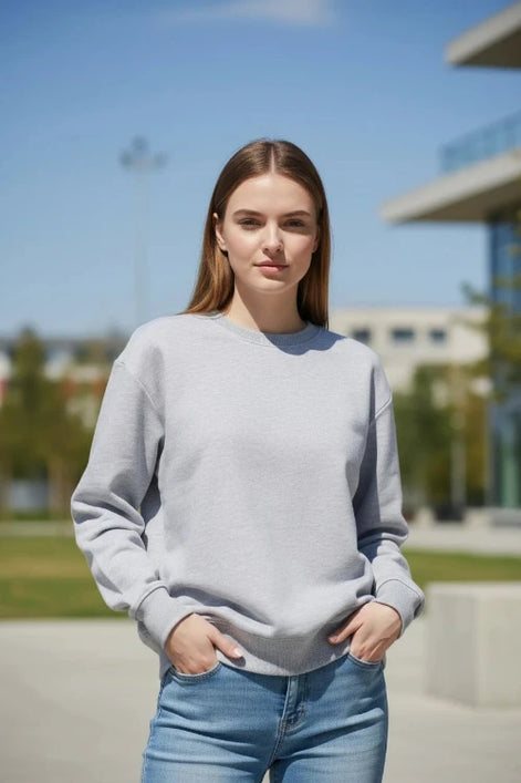 A light gray crewneck sweatshirt by KANNISAK, shown flat against a white background with a soft drop shadow.