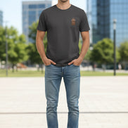 Black t-shirt with a brown patch on a hanger