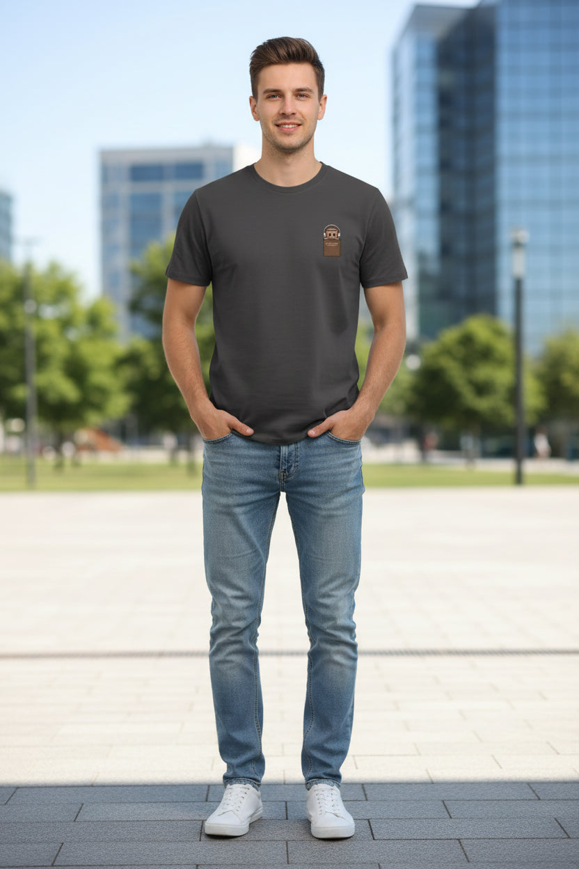 Black t-shirt with a brown patch on a hanger