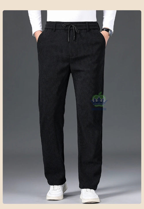 Black pants worn by a person on a gray background