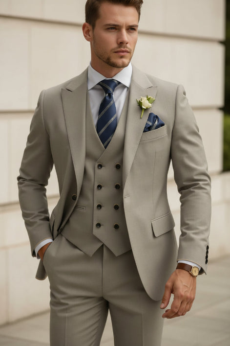 Beige suit with striped tie and pocket square on a white background
