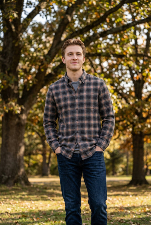 A folded long-sleeve plaid button-down shirt in charcoal gray and dusty pink, shown on a clean white background.