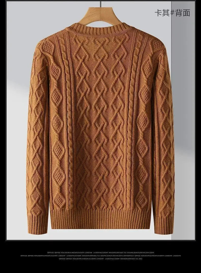Brown sweater with intricate pattern on a hanger against a gray background