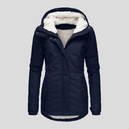 Front view of a navy hooded zip-up jacket with white fleece-look lining and buttoned front pockets against a light background