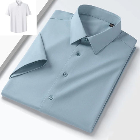 A folded light blue long-sleeve dress shirt with a pointed collar and matching buttons, shown on a clean white background. A small inset in the top-left corner shows a white short-sleeve shirt.