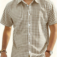Man wearing a brown and white checkered shirt with a neutral background