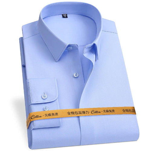 A light blue long-sleeve dress shirt folded neatly with a collar, chest pocket, and visible buttons, wrapped with a yellow-orange paper band across the lower front.
