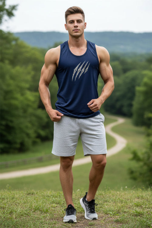 A muscular man wearing a navy blue athletic tank top with a distressed silver claw graphic on the chest, set against a plain light background.