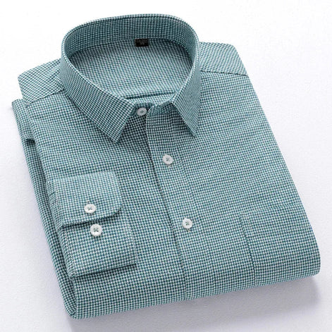 A folded long-sleeve button-down dress shirt with a fine green and white micro-check pattern, featuring a pointed collar,