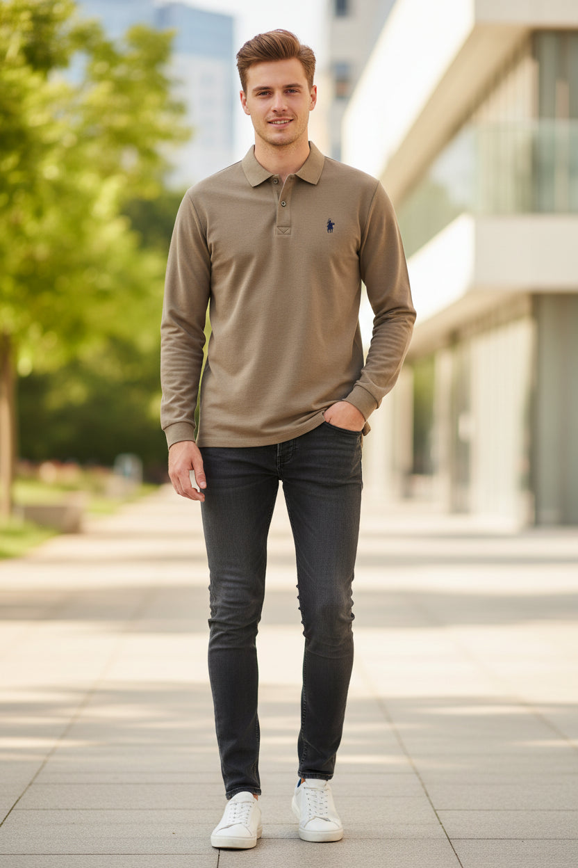 Brown long-sleeve polo shirt with a logo on a hanger in a clothing store.