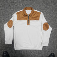 A white ribbed knit long-sleeve quarter-zip pullover sweater with tan faux-suede 
