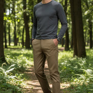 Beige pants worn by a person on a gray background